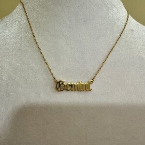 Gold toned old English Gemini necklace​​​​​​​​